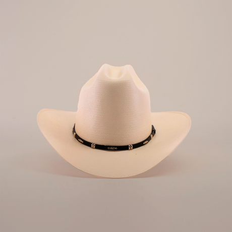 The 500X Dos Carnales Straw Hat, featuring a white design with a black band and small silver accents, showcases style and resilience against a plain white background.