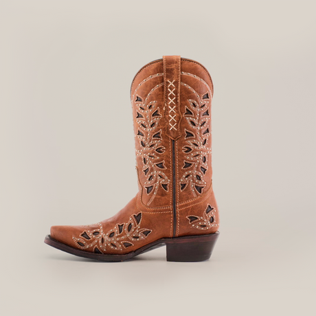 The Flipy Honey - Short Shaft - Snop Toe boot, shown sideways on a white background, boasts decorative leaf-shaped cutouts and white stitching. With traditional craftsmanship, it includes a premium leather sole, low heel, and pointed toe. An ideal addition to womens boots collections.