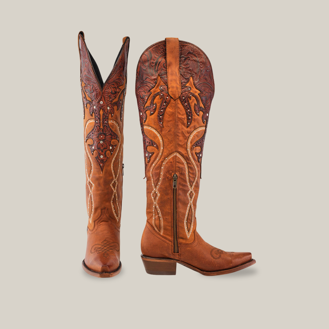 The Miriam Brick - Tall Shaft - Snip Toe cowboy boots, made of premium brown leather, feature intricate embroidery, detailed stitching, and a side zipper. One boot stands upright while the other is angled on a white background—perfect for womens style and comfort.