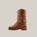 The Graffiti Yellow - Rodeo Toe is a single cowboy boot crafted from genuine leather, boasting intricate white stitching and decorative patterns. Its classic Western style, rounded toe, and slightly worn look make it perfect for young cowgirls seeking authentic flair against a plain white background.