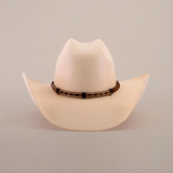 The 5000x Chihuahua Straw Hat, crafted with exquisite craftsmanship, is cream-colored with a curved brim and features a brown leather band with a woven design, beautifully displayed against a plain white background.