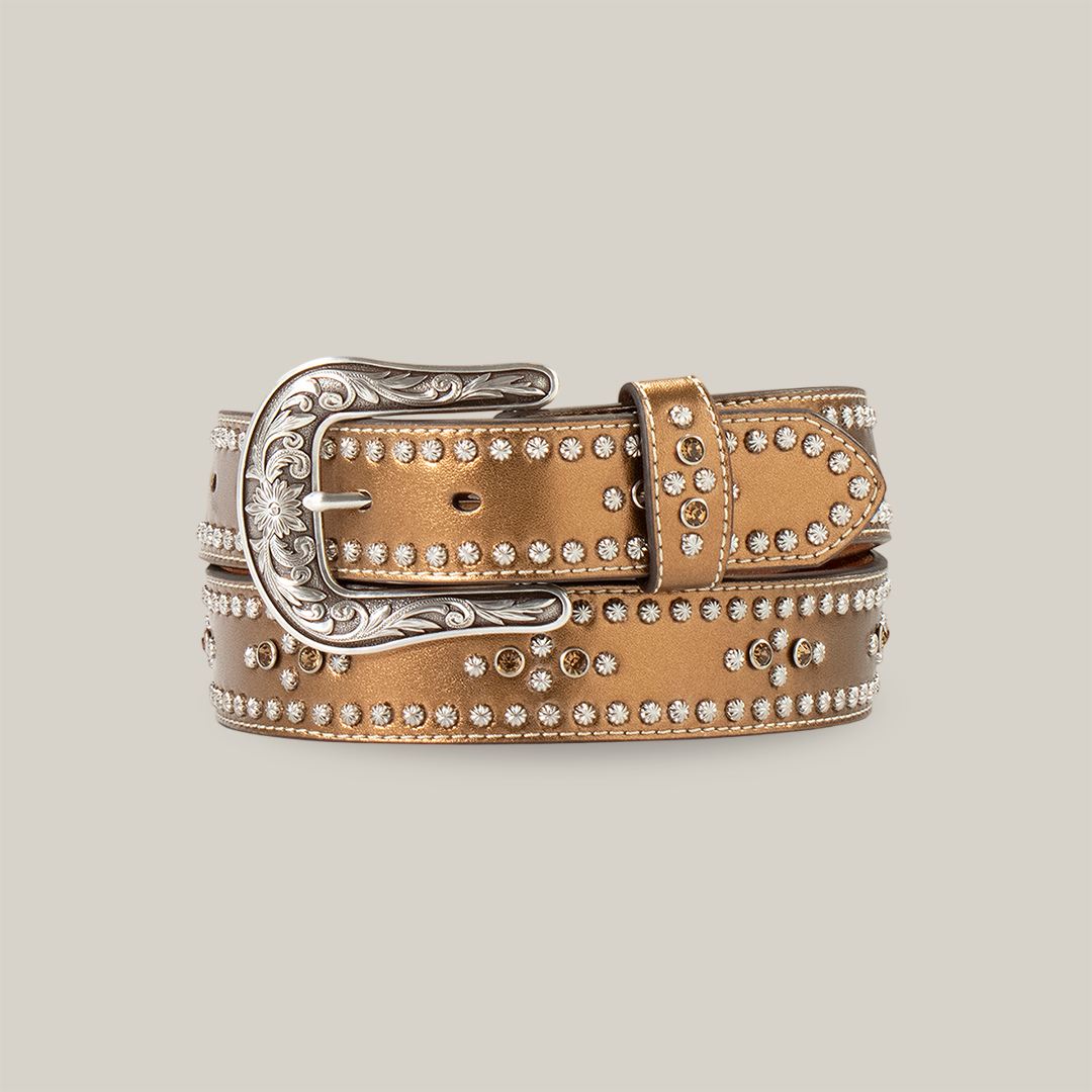 The Ariat Western Womens Belt, crafted in brown leather with shining rhinestones and an ornate silver buckle, exudes a western flair and sophistication, making it a standout addition to any outfit.