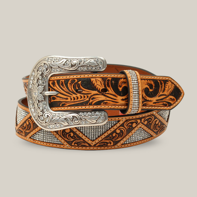 This Angel Ranch Western womens belt in tan leather features intricate floral inlays and stones, with an ornate design exuding elegance. Its varied textures make it a standout piece for those seeking timeless style.