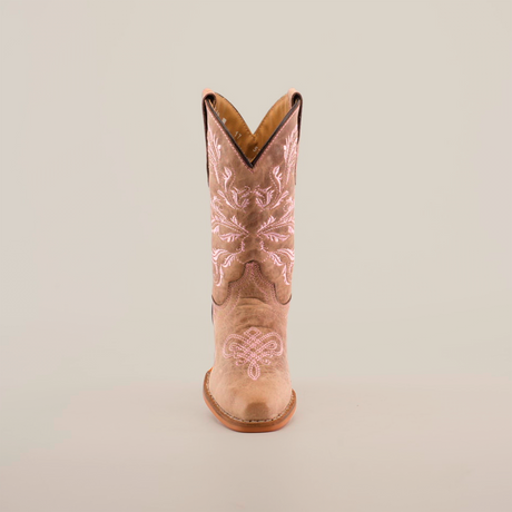 The Bellere Fawn - Snip Toe boot, crafted from premium cowhide leather, is a single tan cowboy boot featuring intricate white embroidery. It stands upright on a plain white background, highlighting its classic western design with a slightly pointed toe and low heel.