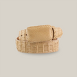 The Exotic Full Quilt Caiman - Bone Belt is an eye-catching light beige accessory with a textured crocodile leather surface and unique pattern. Coiled circularly, it features a rectangular buckle and rests against a plain white background.