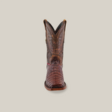 The Exotic Caiman Hornback boot showcases a pointed rodeo toe and a high shaft with exquisite stitching, crafted from brown caiman leather with intricate hornback details, and is displayed against a plain white background.