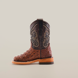 The Caiman Hornback Print Chocolate Square Toe is a single cowboy boot featuring exceptional leather craftsmanship with a brown, crocodile-patterned foot and a black shaft adorned with intricate embroidery, all set against a plain white background.