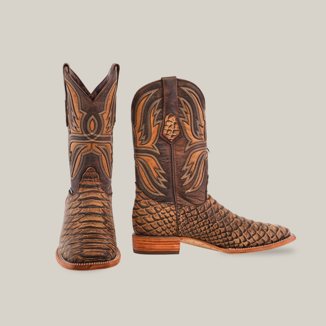 The Jumbo Python Print Camel cowboy boots, crafted from premium cowhide leather, are displayed on a plain white background. They feature textured leather with an elaborate pattern, a wooden heel, and a square toe, showcasing exceptional craftsmanship.