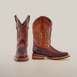 A pair of brown Azkar Moka Slip Resistant Sole Rodeo Toe cowboy boots with intricate stitching. The left boot is upright, and the right boot is slightly angled. With a wooden heel, these stylish boots are set against a plain white background.