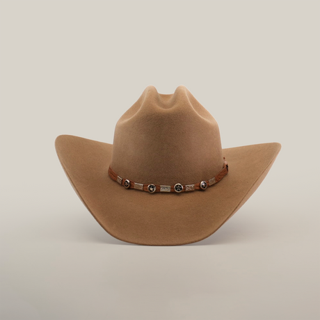 The 6X Country Fawn is a light brown felt cowboy hat featuring a wide brim and a leather band with silver conchos, set against a plain white background.