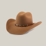 The 6X Chihuahua Fawn is a Western hat made from premium sheep wool, featuring a curved brim and crown crease. Its adorned with a decorative band of small square ornaments and tied brown cord on the side, embodying the perfect blend of style and tradition.