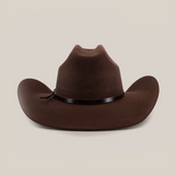 The 6X Bull Brown is a premium felt Western hat in dark brown featuring a sleek black band around its high pinched crown and a wide brim, epitomizing classic luxury Western wear. Its the perfect accessory for any stylish cowboy enthusiast.