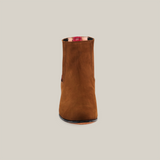 On a plain white background, the Prime Suede Caramel Round Toe ankle boot takes center stage, displaying its classic Western charm with a slightly rounded toe and subtle side stitch detail.