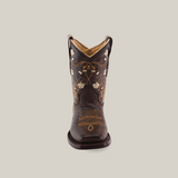 The Dariela Chocolate - Square Toe is a premium leather cowboy boot in dark brown, featuring intricate floral embroidery and stitching. This elegant piece is displayed front-facing against a plain white backdrop.