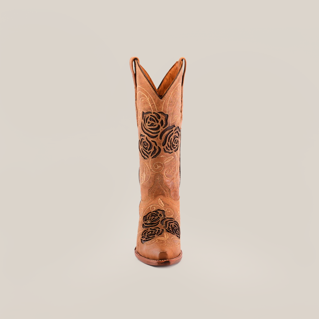 The Rosal Fawn Mid Shaft boot exudes handcrafted elegance, featuring premium leather with exquisite black rose floral embroidery. It stands elegantly on a plain white background, embodying style and sophistication.