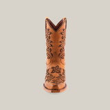 The Cosala Honey - Snip Toe is a brown cowboy boot featuring intricate floral patterns along the shaft. Photographed from the front against a white background, this genuine leather boot perfectly embodies classic western style and craftsmanship.