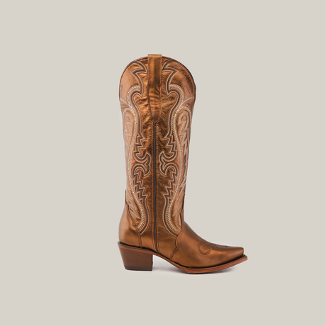 The Nihan Copper - Tall Shaft - Snip Toe, a single tan leather cowboy boot, represents traditional craftsmanship. Its intricate embroidery enhances the snip toe and tall shaft, set against a plain white background, exemplifying handcrafted excellence.