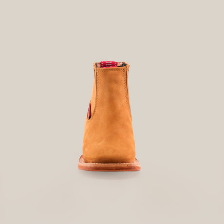 The Prime Suede Honey Square Toe is displayed from the front against a plain white background. This tan suede ankle boot with a red elastic side gusset features a square toe and sturdy sole, crafted from genuine leather for lasting quality and style.