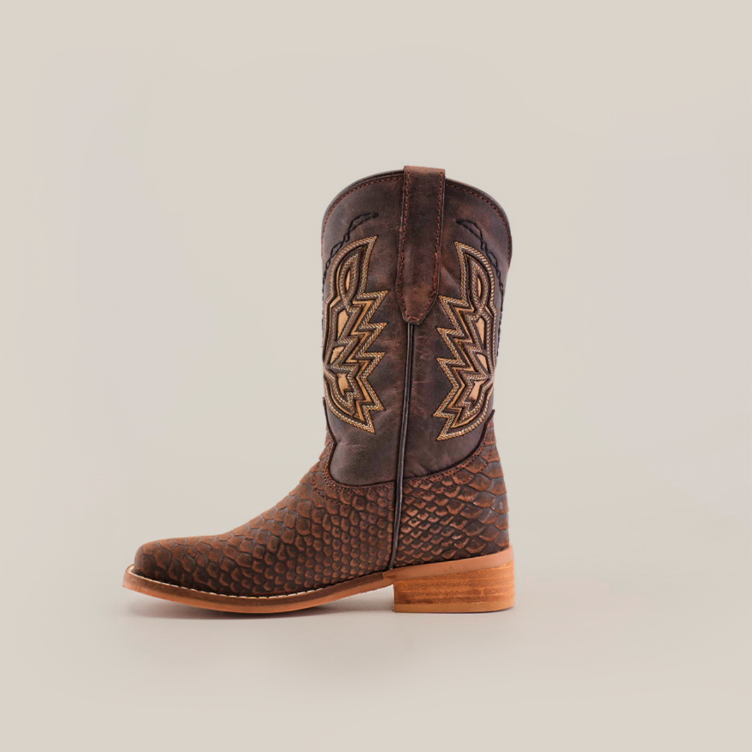 The Python Print Matte Brown Square Toe boot features a single brown cowboy boot with a scaly python print, intricate embroidery on the shaft, a wooden heel, square toe design, and top pull strap for easy wear.