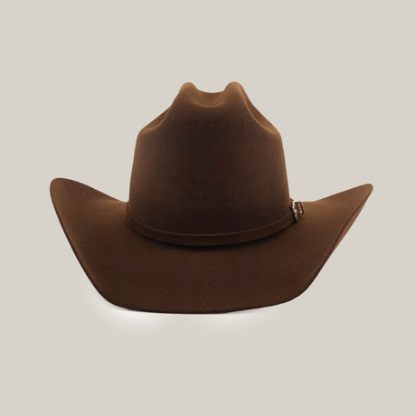 The 6X Leandro Brown cowboy hat, made from premium sheeps wool, showcases a curved brim and pinched crown, isolated on a white background.