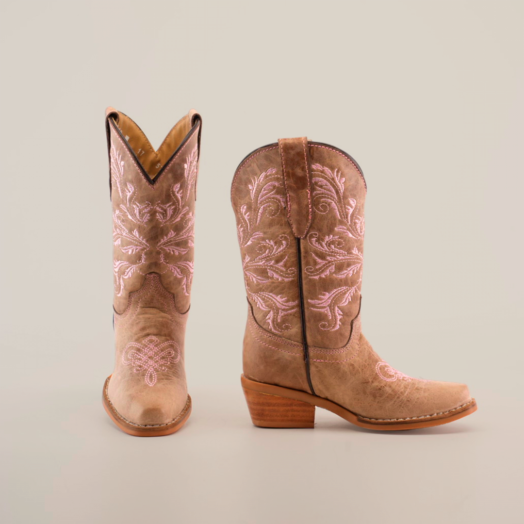 A pair of Bellere Fawn - Snip Toe boots in brown with pink embroidery and mid-height wooden heels crafted from premium cowhide leather. The left boot faces forward, and the right angles to the side, both set against a plain white background.