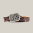 The Ariat Western Womens Filigree Tooled Dark Brown Leather Belt (A10006957) features intricate embossing and a detailed floral design on its ornate silver buckle, showcasing western flair and adding elegance to womens belts. Coiled perfectly, it displays the beautifully crafted buckle.