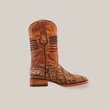 The American Alligator Print Rustic Orix - Square Toe cowboy boot features brown leather with unique stitching and an American flag motif on the shaft. Its lower part showcases an alligator print, paired with a sturdy flat heel and durable leather sole, all set against a plain white background.