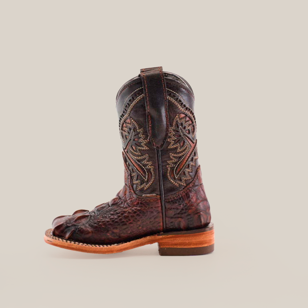 The Alligator Head Print Rustic Honey Square Toe cowboy boot features intricate embroidery and a unique alligator claw design at the toe, crafted from premium leather, on a plain white background.