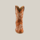 The Rama Honey Snip Toe cowboy boot showcases a genuine leather design with white floral embroidery on the brown shaft, featuring a classic pointed toe and low heel, complemented by stylish stitched detailing along the sides.