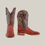 The Caiman Hornback Print Cogñac - Square Toe boot features a rich Caiman Hornback Print in Cognac on premium cowhide, intricate stitching, and a low wooden heel, all set against a white background.