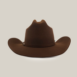 The 6X Leandro Brown is a premium cowboy hat made from sheeps wool, featuring a wide brim and slightly indented crown, elegantly displayed on a plain white background to highlight its quality craftsmanship.