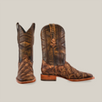 A pair of Big Bass Pirarucu Print Rustic Orix cowboy boots crafted from cowhide leather with a textured brown finish. One boot faces forward, displaying its square toe design, while the other is slightly turned against a plain white background.