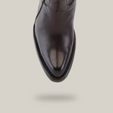 A top-down view of the Francia Rings Tall Shaft Chocolate - J Toe boot, made from premium black leather with a pointed J toe and visible stitching along the sole, set against a plain white background.