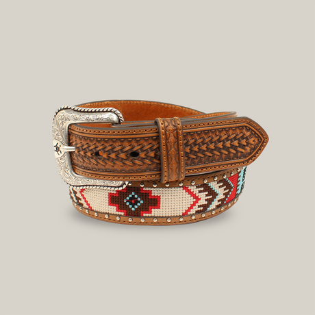 Experience rugged elegance with the Ariat Mens Brown Basketweave Western Belt (A1033297), featuring a decorative silver buckle, red, black, and turquoise Aztec beaded patterns, textured leather accents, and metal studs—perfect for embracing Western heritage.