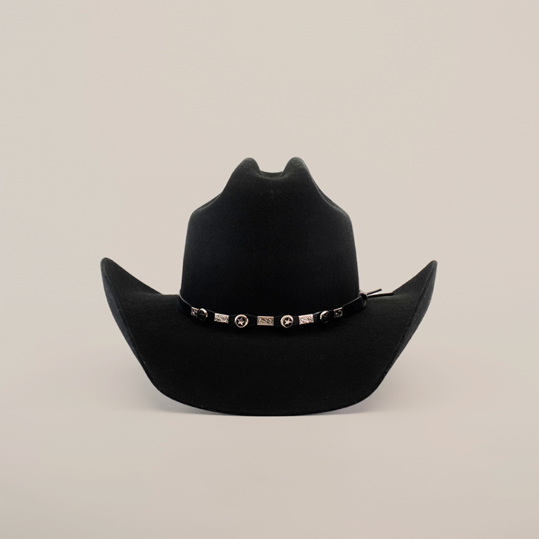 The 6X Leandro Black cowboy hat boasts a wide brim with upward curled sides and a decorative band adorned with shiny conchos and rectangular studs. Crafted from premium sheeps wool, this luxurious hat stands out beautifully against its plain white background.