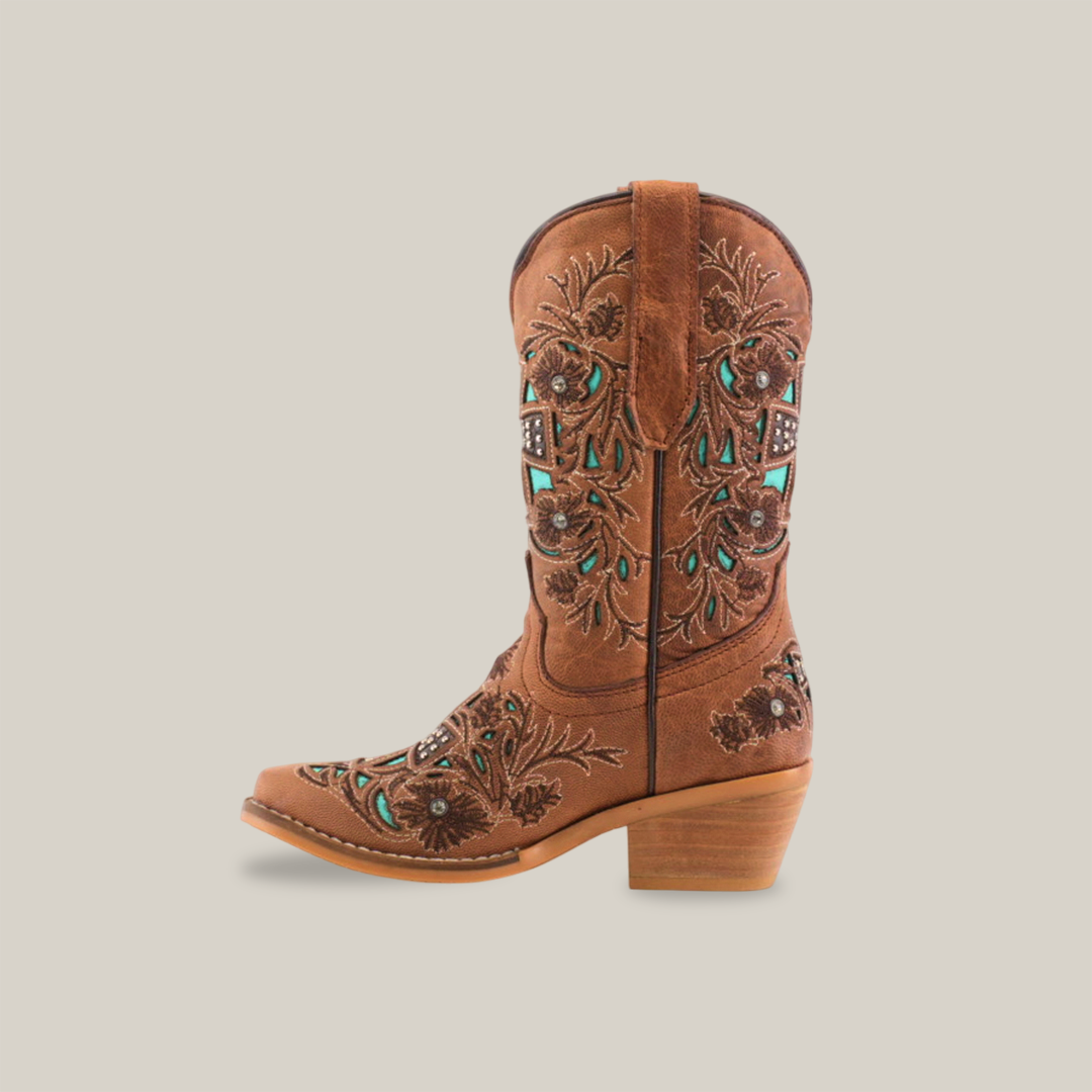 The Alamo Studs Honey -+ Snip Toe is a brown cowboy boot made from fine cowhide leather, featuring intricate embroidery and turquoise accents. It has a medium wooden heel and slightly pointed toe, all set against a plain white background.