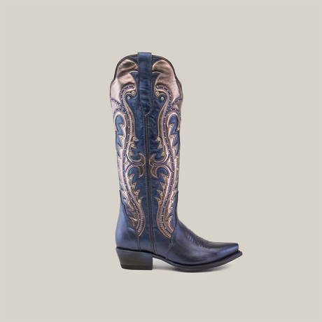 The Valentina Navy - Tall Shaft - Snip Toe features a snip-toed blue cowboy boot with detailed golden embroidery along the shaft, capturing Western spirit. It is crafted with a low heel and is elegantly set against a plain white background.