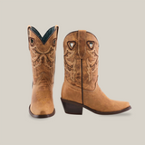 The Matcat Fawn - Snip Toe boots are handcrafted from premium tan leather, featuring decorative stitching, pointed toes, stacked heels, and triangular cutouts near the top. The left boot is angled forward while the right boot faces sideways.