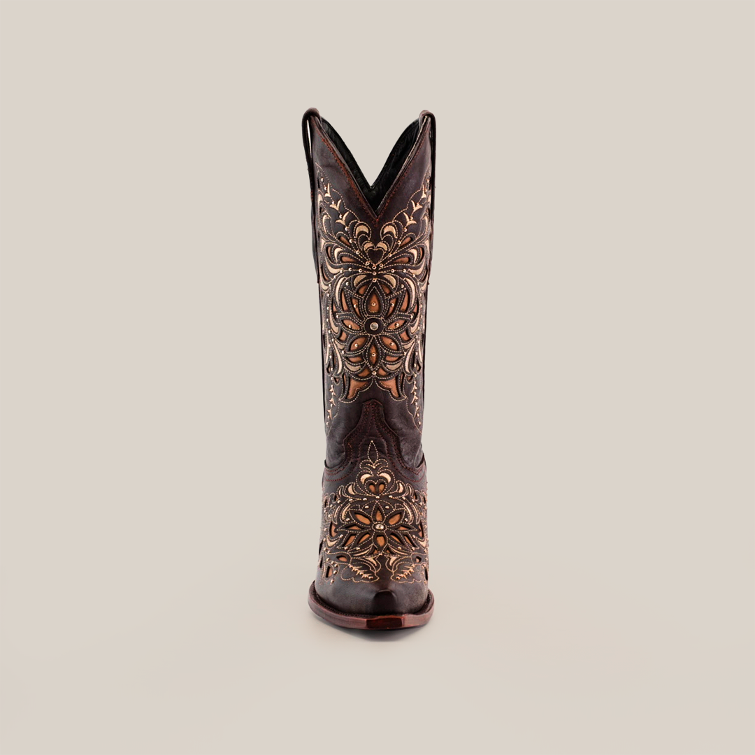 The Kiara Crystals Chocolate cowboy boot stands upright against a white background, showcasing its snip toe and intricate gold and bronze embroidery. Handcrafted with care, this stunning piece of western footwear is adorned with elaborate stitching in a rich dark brown color.