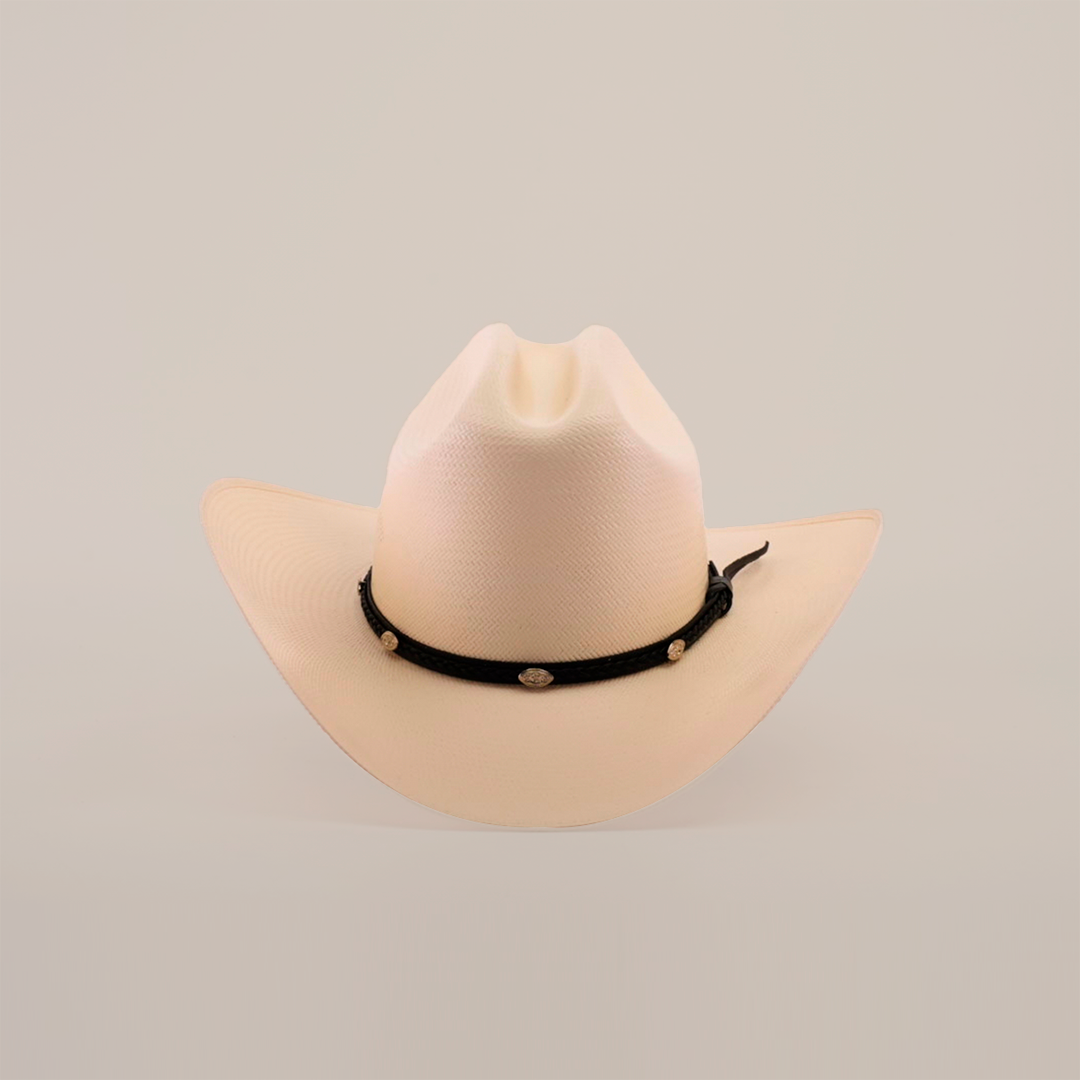 Introducing the 500X Sinaloa Straw Hat, a beige cowboy hat with timeless style and unmatched quality. It features a wide brim and a black decorative band adorned with round golden ornaments, beautifully set against a plain white background.