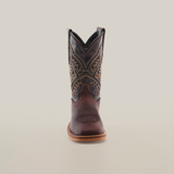 Front view of the Salvage Almond Square Toe, a single brown cowboy boot made from premium cowhide leather, showcasing intricate stitching and a pointed toe, set against a plain white background.