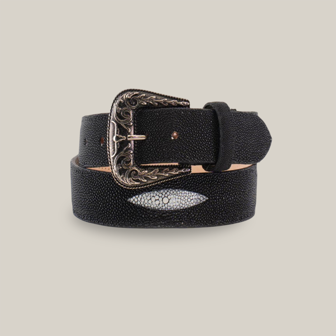 The Exotic Full Quilt Stingray - Texas Buckle - Black Belt is a luxury accessory featuring a decorative silver Texas-style buckle with intricate patterns. It has a small oval textured design that mimics light gray stingray leather on the strap against a plain white background.