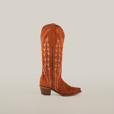 The Caroly Brick Suede boot features a tall shaft, snip toe design in premium leather, with decorative stitching and a medium heel.