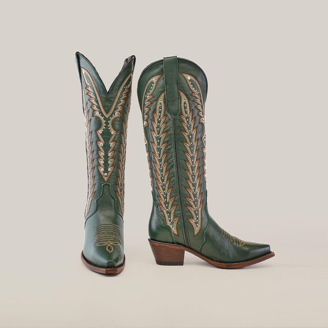 Introducing the Madona Forest Green boots: tall, handcrafted leather cowboy boots with intricate beige stitching. The left boot is angled to show the front, while the right displays the side. Featuring classic snip toes and wooden heels on a pristine white background.