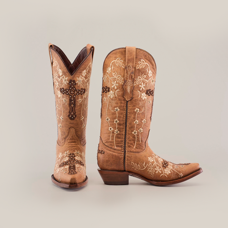 Handcrafted Marga Cruz Fawn Crystals boots feature intricate white floral embroidery and studded details. These premium leather mid-shaft snip toe cowboy boots are elegantly set against a plain white background.