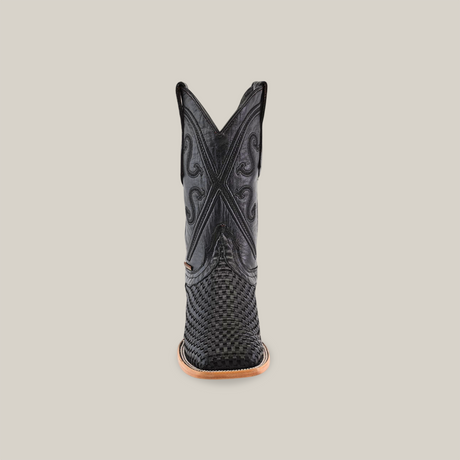 A single Texas Basket Weave Black - Square Toe cowboy boot, featuring intricate embroidery and crafted from premium cowhide leather, displayed from the back against a plain white background.